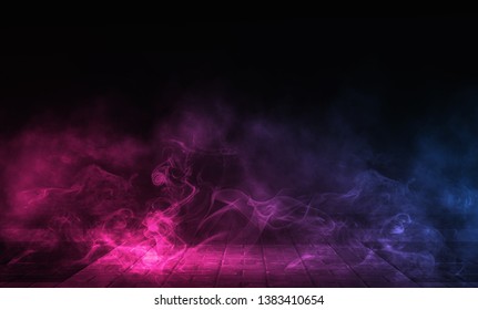 Empty background scene. Dark reflection of the street on the wet asphalt. Rays of neon light in the dark, neon figures, smoke. Night view of the street, the city. Abstract dark background.