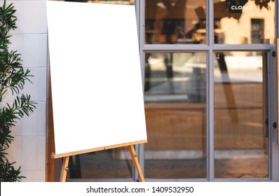 Mockup billboards or white promotion poster displayed on the front of the restaurant, coffee shop Promotion information for marketing announcements and details