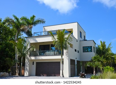 Beautiful New Florida House with Palms Trees and Landscaping Near the Beach. Would Make a Great Vacation Rental Property. 