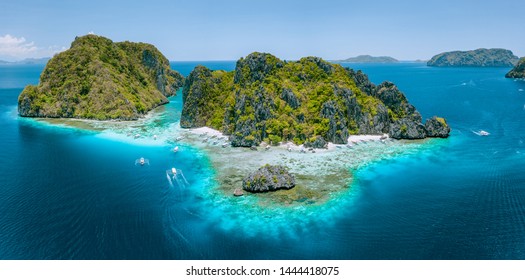 Luchtfoto drone uitzicht op tropische Shimizu Island steile rotsen en wit zandstrand in blauw water El Nido, Palawan, Filippijnen. Toeristische attractie mooiste beroemde natuurgebied Marine Reserve Park