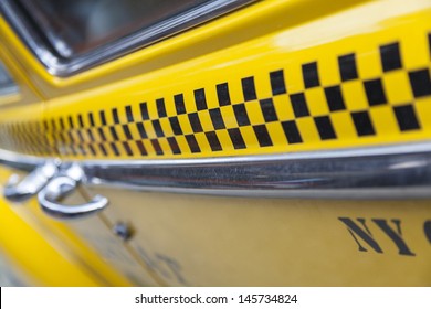 Close up background photograph of the side of New York City Yellow Taxi Cab