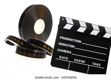A black film case reel and a cinema clap isolated on white