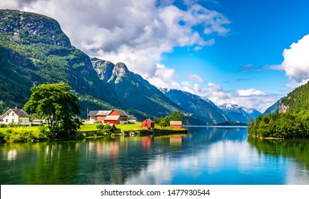 Amazing nature view with fjord and mountains. Beautiful reflection. Location: Scandinavian Mountains, Norway. Artistic picture. Beauty world. The feeling of complete freedom