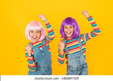 Anime convention. Anime cosplay party concept. Animation style characterized colorful graphics vibrant characters fantastical themes. Happy little girls. Anime fan. Cheerful friends in colorful wigs.