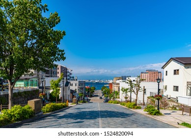 View of Hachiman-zaka Slope in summer sunny day white clouds and bule sky. A sloped street made famous in movies and commercials. Popular Sightseeing Spot in Hakodate City, Hokkaido, Japan