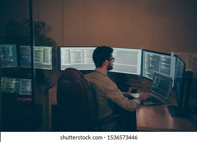 Photo of it-specialist working on global project using laptop testing alpha version of newly developed software checking bug existence debugging script code