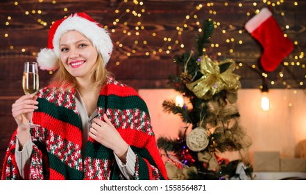 Dear santa. xmas morning joy. woman santa hat at decorated new year tree. ready for holidays. happy woman in cozy plaid. girl drink champagne. happy new 2020 year. merry christmas.