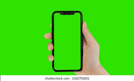 man's hand holding phone a mobile telephone with a vertical green screen in tram chroma key smartphone technology cell phone touch message display hand with luma white and black key