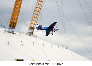 LONDON - 2/3 AUGUST 2008: Red Bull Air Race London 2008 - Sergy Rakhmanin racing over the Thames River at the O2, North Greenwich