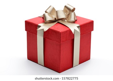 Scatola regalo rossa con nastro dorato e fiocco