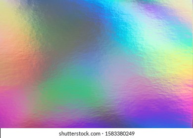 Abstract trendy rainbow holographic background in 80s style. Blurred texture in violet, pink and mint colors with scratches and irregularities. Pastel colors.
