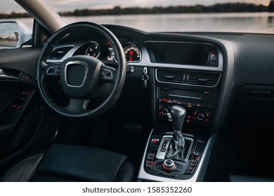 Modern car dashboard and interior at the evening