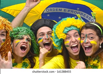 Group of Brazilian soccer fans commemorating victory.
