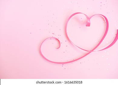 Ribbon heart. Soft pastel background to Valentine`s Day. Light pink sparkles. Flat lay. Valentines Day 2021. Romantic wallpaper. Stories background template. Banner lovers day sale. Wedding invitation