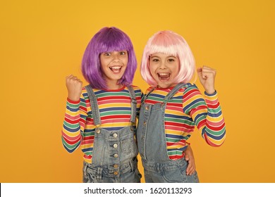 Anime fan. Animation style characterized colorful graphics vibrant characters fantastical themes. Anime convention. Happy little girls. Cheerful friends in colorful wigs. Anime cosplay party concept.