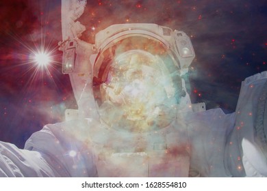 Astronaut at spacewalk. Cosmic landscape. Elements of this image furnished by NASA