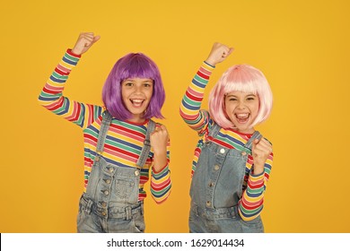 Anime convention. Anime cosplay party concept. Animation style characterized colorful graphics vibrant characters fantastical themes. Happy little girls. Anime fan. Cheerful friends in colorful wigs.