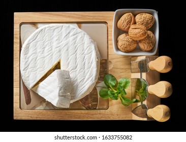 Round soft cheese, with a section cut