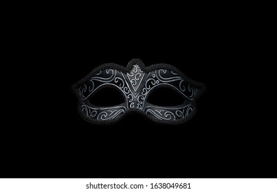 Máscara de carnaval de venecia negra aislada en el fondo de la espalda