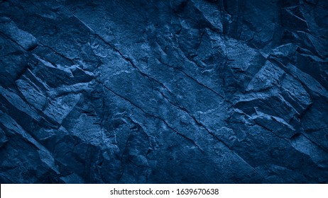 青い石の背景。トーンの岩のテクスチャです。閉じる。あなたのデザインのコピー スペースと暗い青グランジ背景。