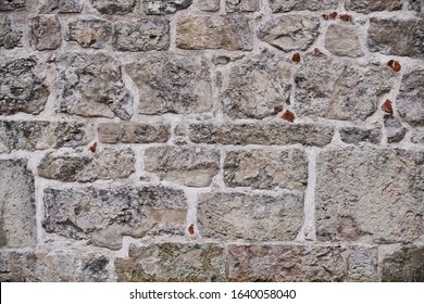 Textuur van een stenen muur. Oude kasteel stenen muur textuur achtergrond. Stenen muur als achtergrond of textuur. Een deel van een stenen muur, voor achtergrond of textuur