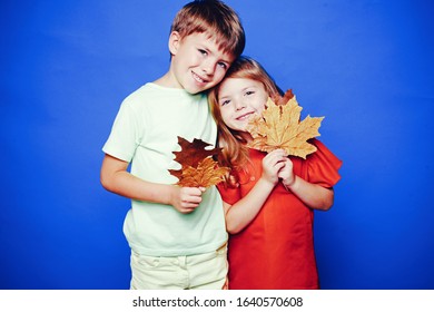 Place for your text. Happy baby. Autumn leaves background. Leaf fall happy people and joyHello november. Autumn Clothing and color trends. Leaf fall leaves isolated. Happy childhood