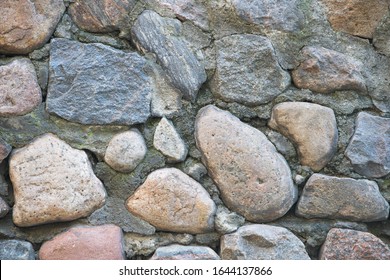 Textura de un muro de piedra. Fondo de textura de pared de piedra de castillo viejo. Muro de piedra como fondo o textura. Parte de un muro de piedra, de fondo o textura.