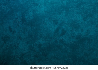 Textur von Stuck in einer heterogenen türkisfarbenen Farbe gemalt