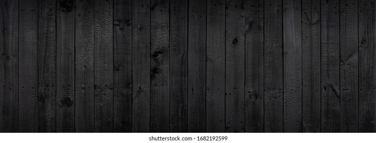 Fondo de textura de madera negra procedente de un árbol natural. El panel de madera tiene un hermoso patrón oscuro que está vacío.