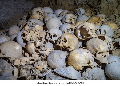 Skulls collected by cannibals in a cave in Papua New Guinea