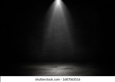 Empty space of Studio dark room black concrete wall and spotlight with concrete floor for showing product.