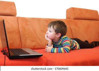 boy is watching a computer screen