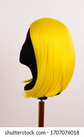 yellow wig short color hair on a mannequin