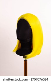 yellow wig short color hair on a mannequin