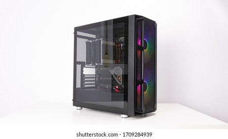 Gaming PC with RGB LED lights and big fans on the front. Computer assembled with hardware components