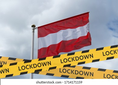The flag of Austria against the sky and a protective tape with the inscription lockdown. Concept - Austria is quarantined due to the coronavirus epidemic.