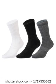 Set of short socks white, grey, black isolated on white background. Three pair of socks in different colors. Sock for sports on invisible foot as mock up for advertising, branding, design.