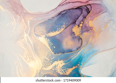 Luxury abstract fluid art painting in alcohol ink technique, mixture of blue and purple paints. Imitation of marble stone cut, glowing golden veins. Tender and dreamy design.