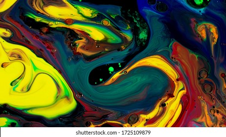 Fluid art background with colorful tints liquid surface. . Amazing effect of acrylic paints on black canvas, mixing different bright colors.