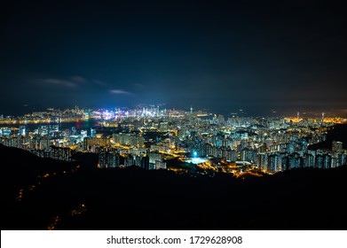 panorama cityscape view of Hong Kong at night, the atmosphere of night lights in the city of the harbor, trade, transportation and international export