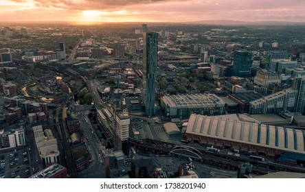 Manchester Cityscape at sunset. Entire city shown with Beetham Tower or the Hilton Hotel in the centre. Aerial view of Manchester city centre. Beautiful city skyline photograph at sunset.