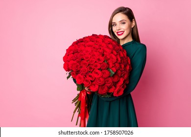 Photo of adorable charming chic lady hold large red long roses bouquet secret admirer boyfriend birthday surprise wear green mini dress isolated pastel pink color background