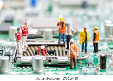 Team of engineers repairing circuit board. Computer repair concept