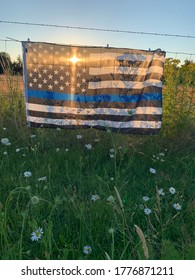 Thin blue line flag at sunset