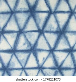 Shibori Tie Dye patterned cotton fabric texture with triangle geometrical pattern