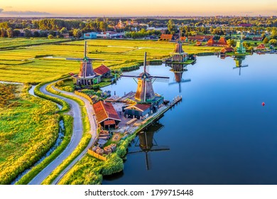 Zaanse Schans windmills park and fields landscape in Zaandam near Amsterdam, North Holland, Netherlands, aerial view in sunrise light