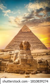 Great sphinx and pyramid under bright sun