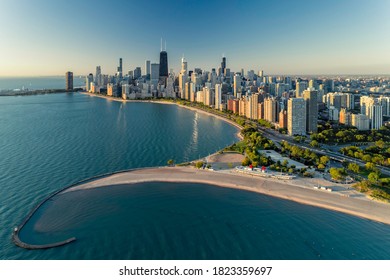Aerial view of Chicago downtown skyline with park and the beach. Morning light with clear blue sky
