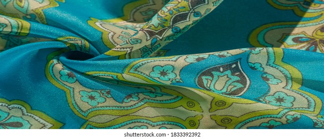 tela de seda multicolor con un patrón de patrones sobre un fondo verde, patrón real. Tendencias de Versalles. patrón jacquard. fondo de textura