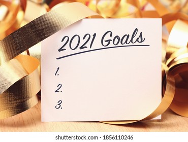 Goals 2021 with beautiful decoration. Discover how setting goals can bring more happiness in your life.